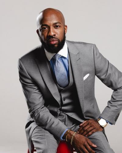 Clifford Taylor posing squatting down