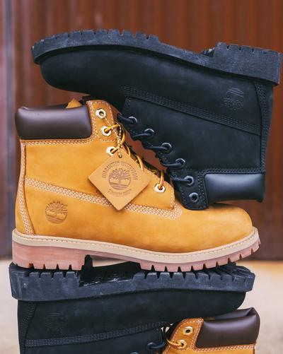 A close-up shot of a with Timberland boots on