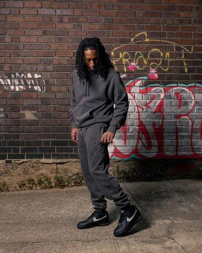 Young man in Nike Air Force 1s and Nike jogger set