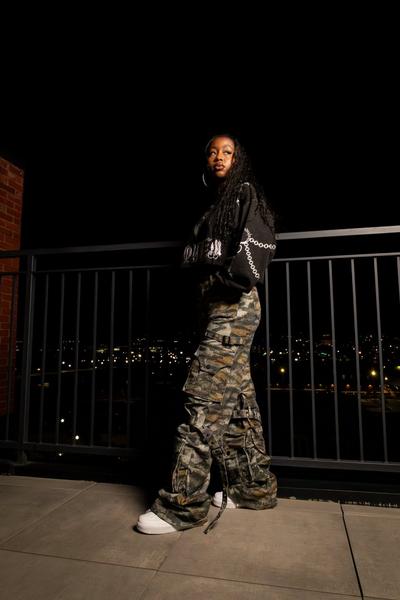 Women in apparel and Nike Court Vision sneakers