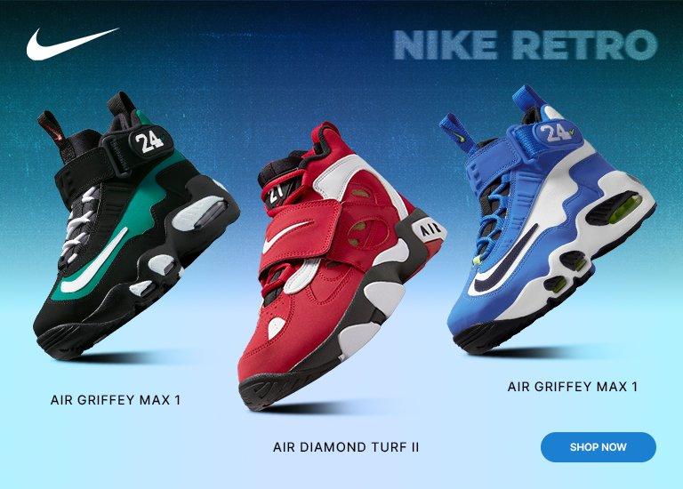 A promotional banner for Nike Retro footwear featuring three sneakers against a blue gradient background. From left to right: a black and teal Air Griffey Max 1, a red and white Air Diamond Turf II, and a blue and white Air Griffey Max 1. The Nike swoosh and 'NIKE RETRO' text appear at the top, with a blue 'SHOP NOW' button in the bottom right corner.