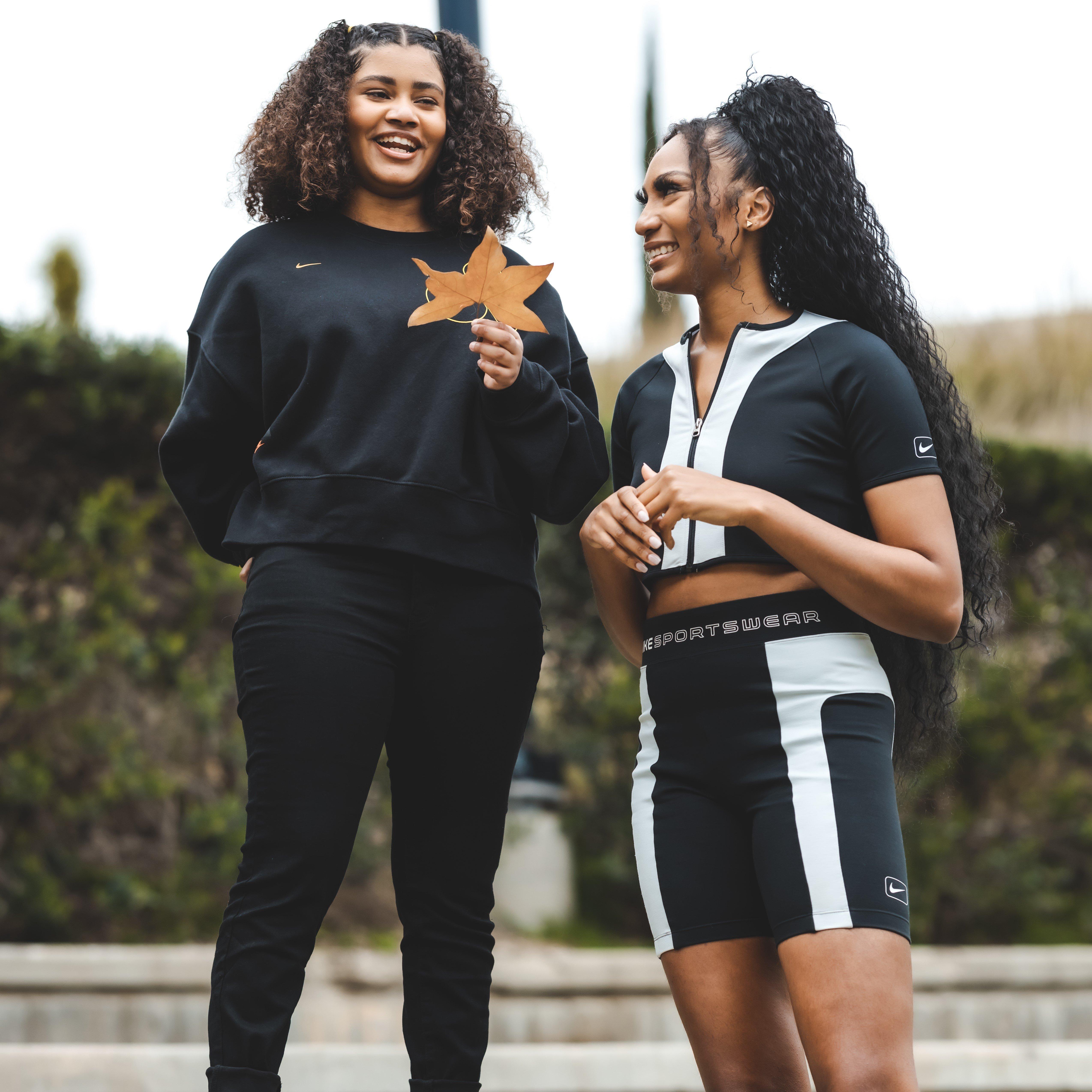 Support Her Sole host Ari Chambers laughing with Haileigh Vasquez