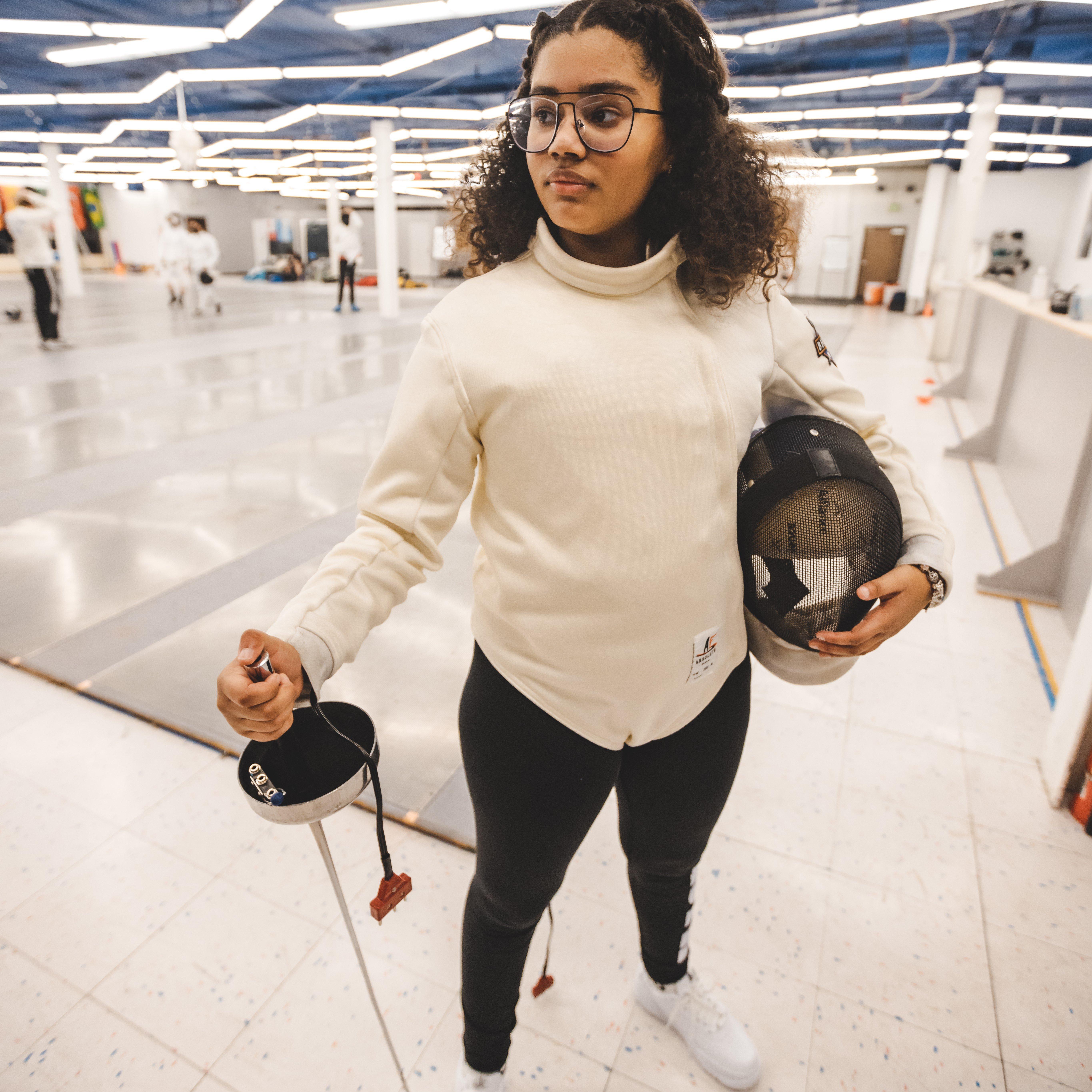 Support Her Sole's Haileigh Vasquez in fencing gear