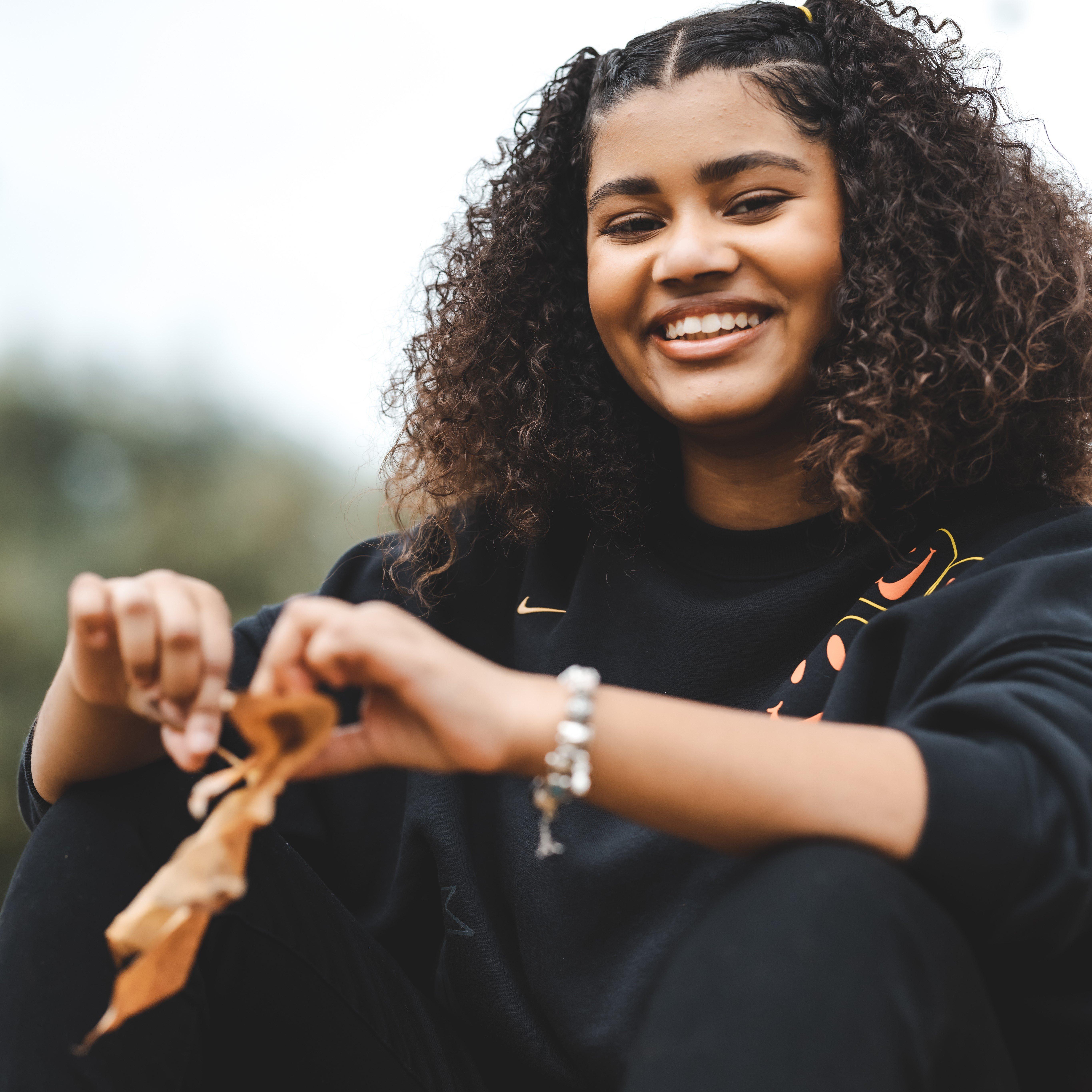 Haileigh Vasquez smiling at camera during Support Her Sole filming
