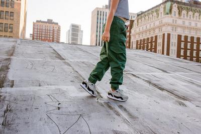 Girl in Saucony sneakers