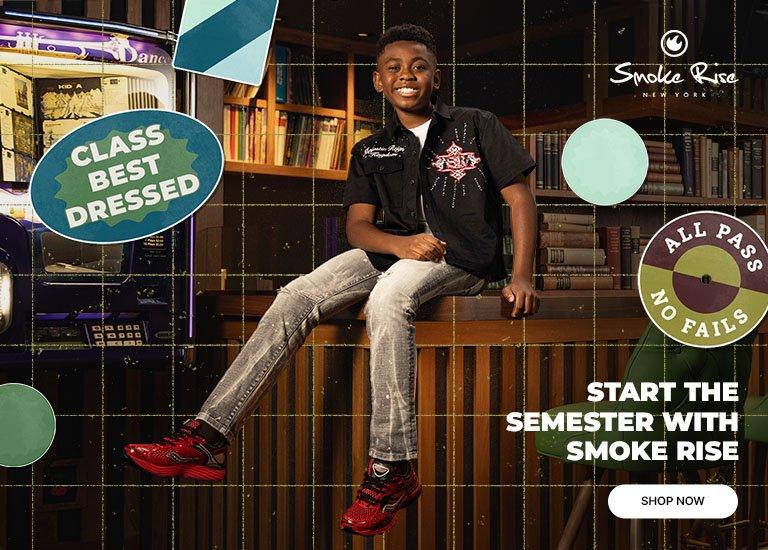 Smoke Rise kids apparel featuring a graphic black button-up shirt, light-wash jeans, and red athletic sneakers, styled in a library-inspired setting with back-to-school graphics and Smoke Rise branding.
