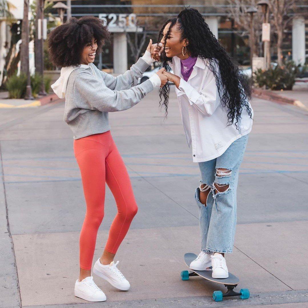 Mychal Bella teaching Ari Chambers to skateboard on set of Support Her Sole episode