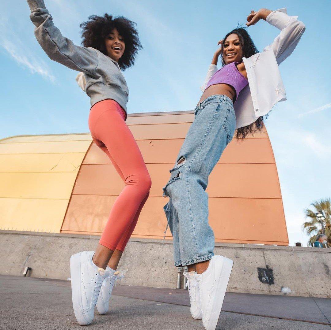 Ari Chambers and Mychal Bella standing on their tip toes in Support Her Sole episode