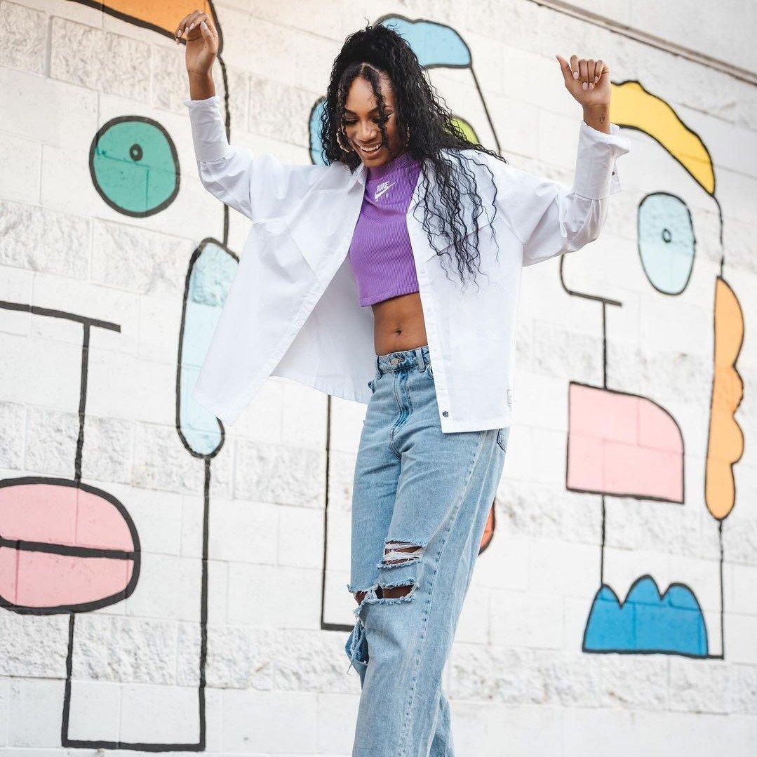 Ari Chambers riding a skateboard on Support Her Sole set