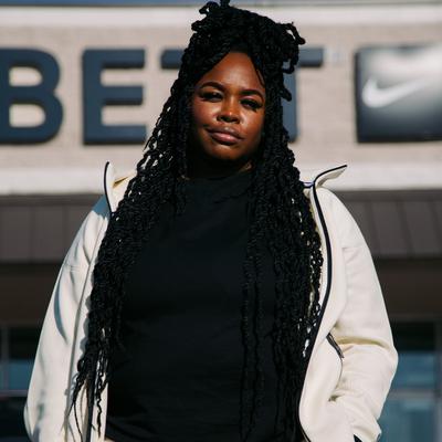 Small Town Sneakerhead Adria Green in front of Hibbett store