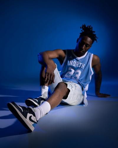 Man in denim shorts and Jordans