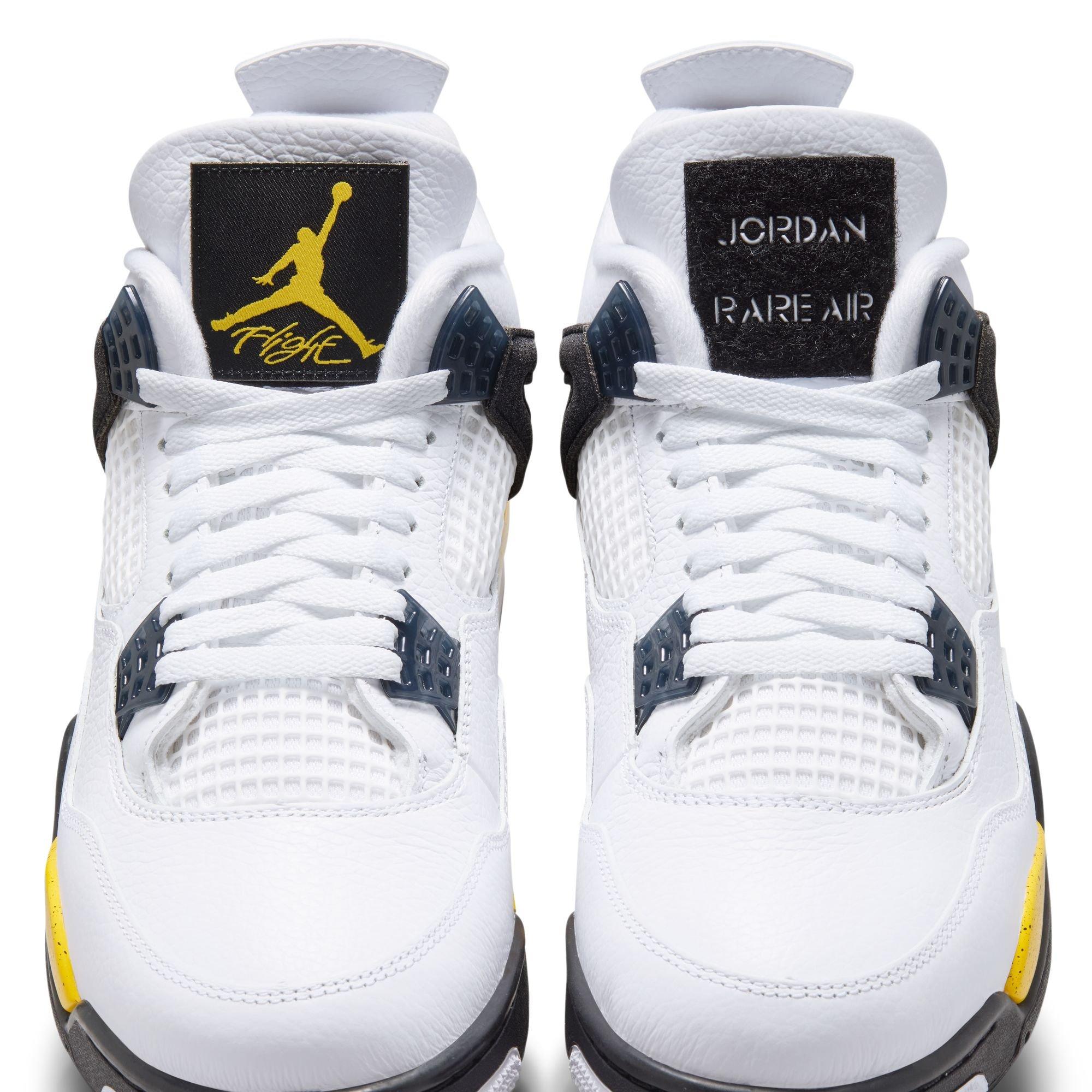 Front view of Air Jordan 4 Tour Yellow sneakers featuring white leather, white laces, dark gray lace wings and removable tongue patches with Jumpman Flight and Jordan Rare Air branding.