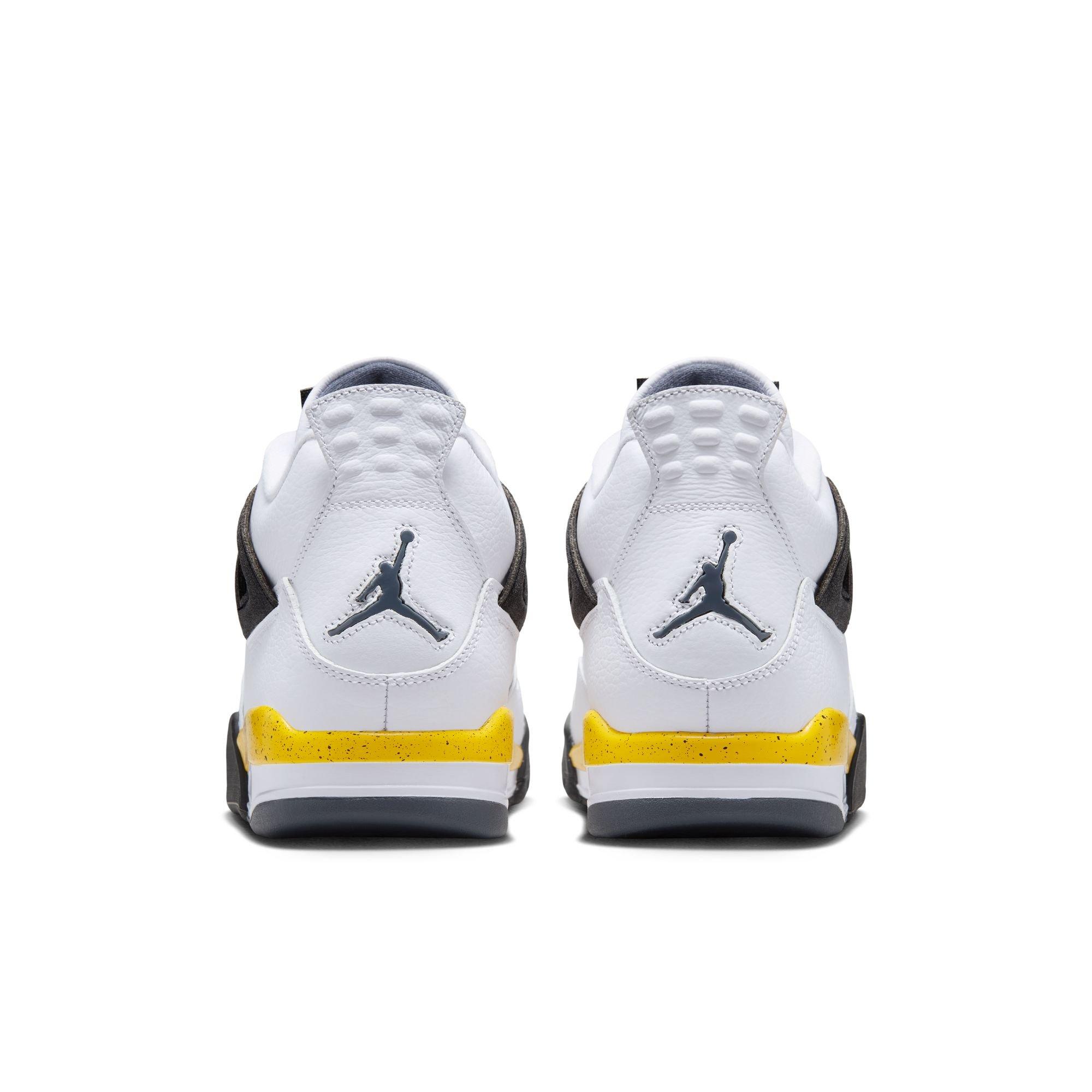 Rear view of Air Jordan 4 Tour Yellow sneakers featuring white leather, gray Jumpman logos and yellow speckled accents above gray outsoles.