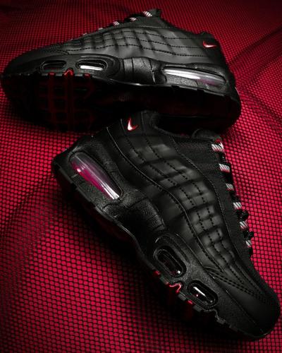A pair of black Nike Air Max 95 sneakers