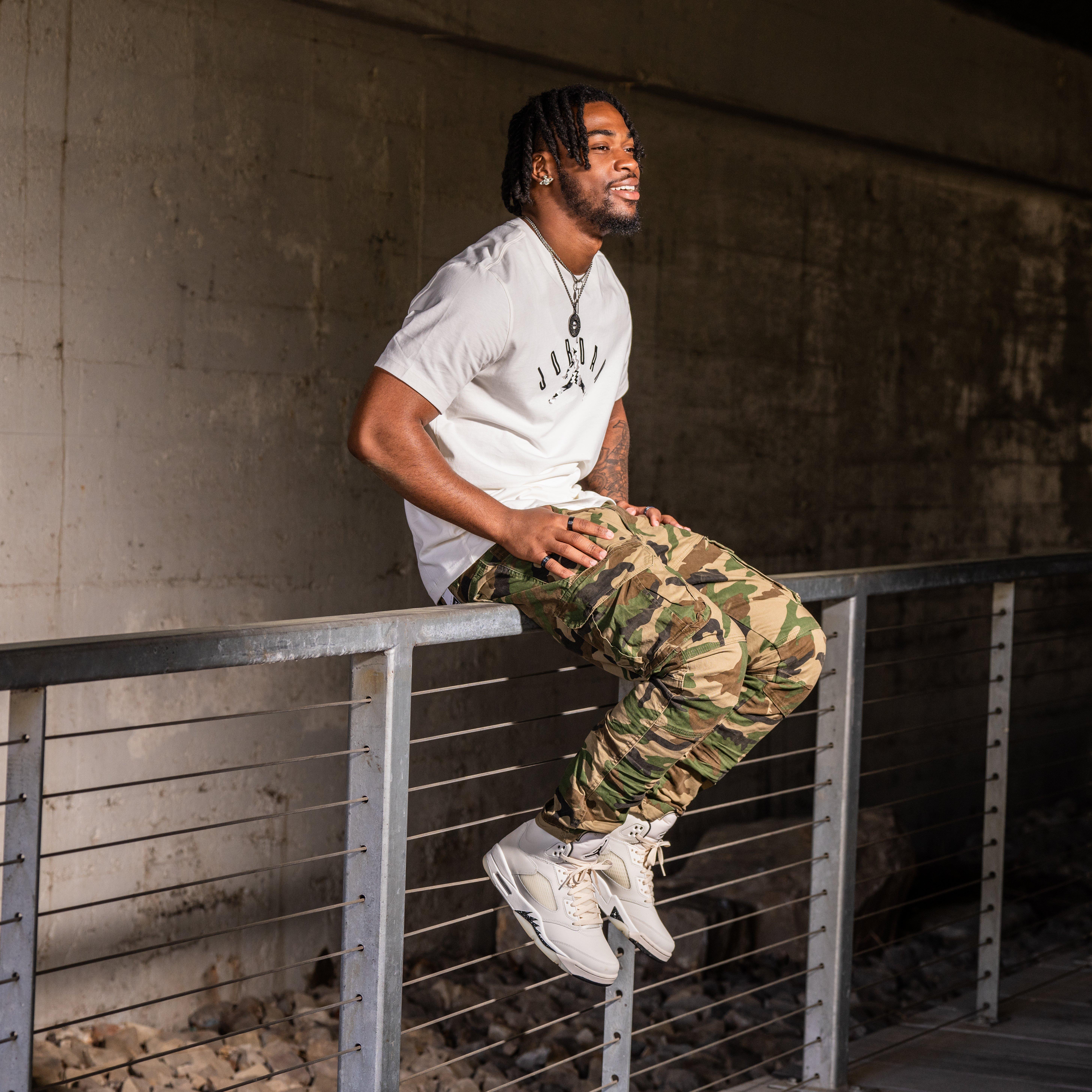 Air Jordan 5 Retro SE "Sail" - Model Posing on Fence