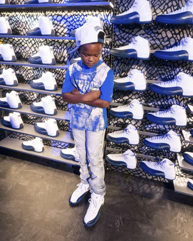 Boy modeling Jordan 12 Retro &ldquo;French Blue and White&rdquo;
