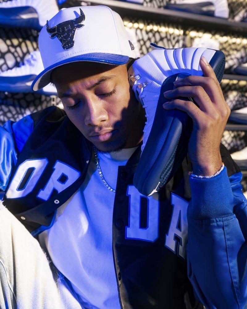 Man holding Jordan 12 Retro &ldquo;French Blue and White&rdquo;