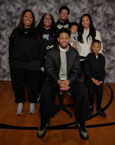 Anfernee Simons posing with members of his family on photoshoot set
