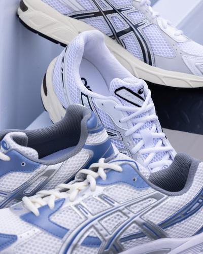 Pairs of Asics shoes in a blue and white colorway