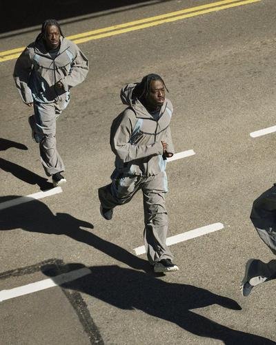 Men running on a road wearing Nike Ava Rover