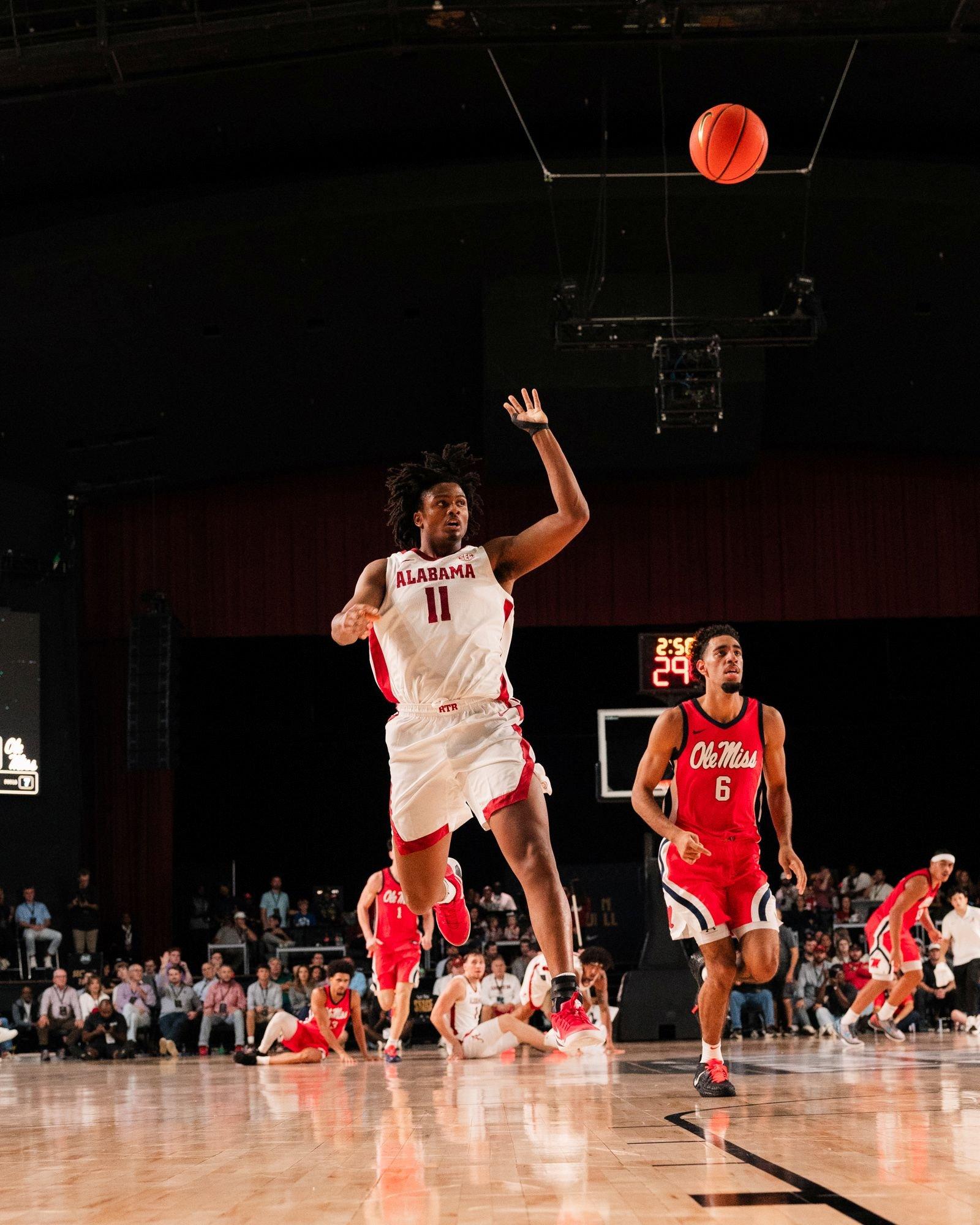 Alabama basketball player goes up for a layup during a game against Ole Miss.