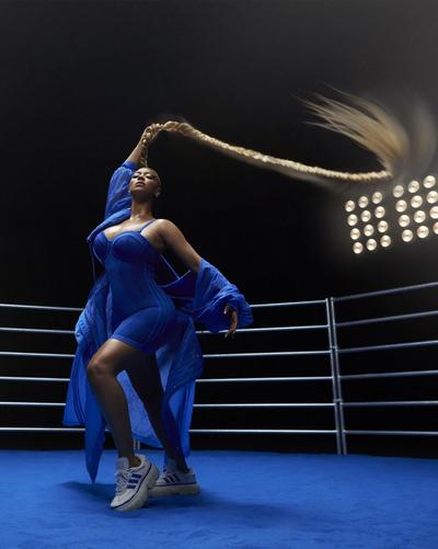 Young man in Streets Is Watchin shirt and Nike Air Max Moto 2K