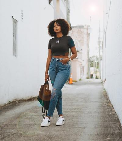 Bianca wearing Nike blazers, cropped tee and jeans