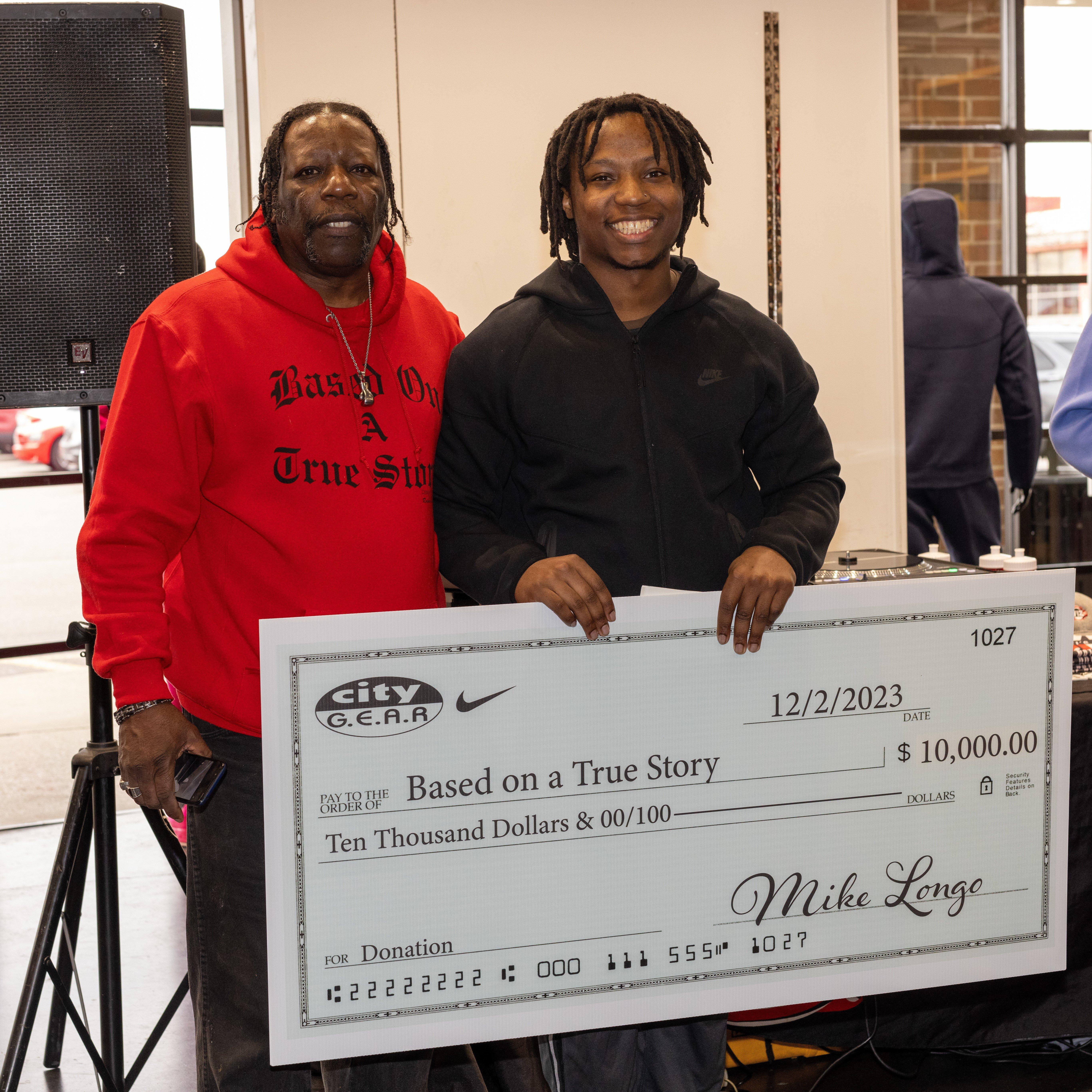 brince-etter-with-community-giveback-donation-check