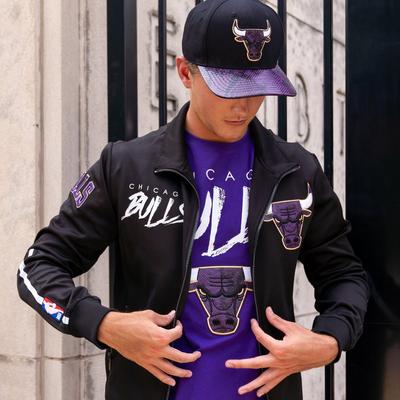 Man wearing Pro Standard purple and black Bulls apparel and cap