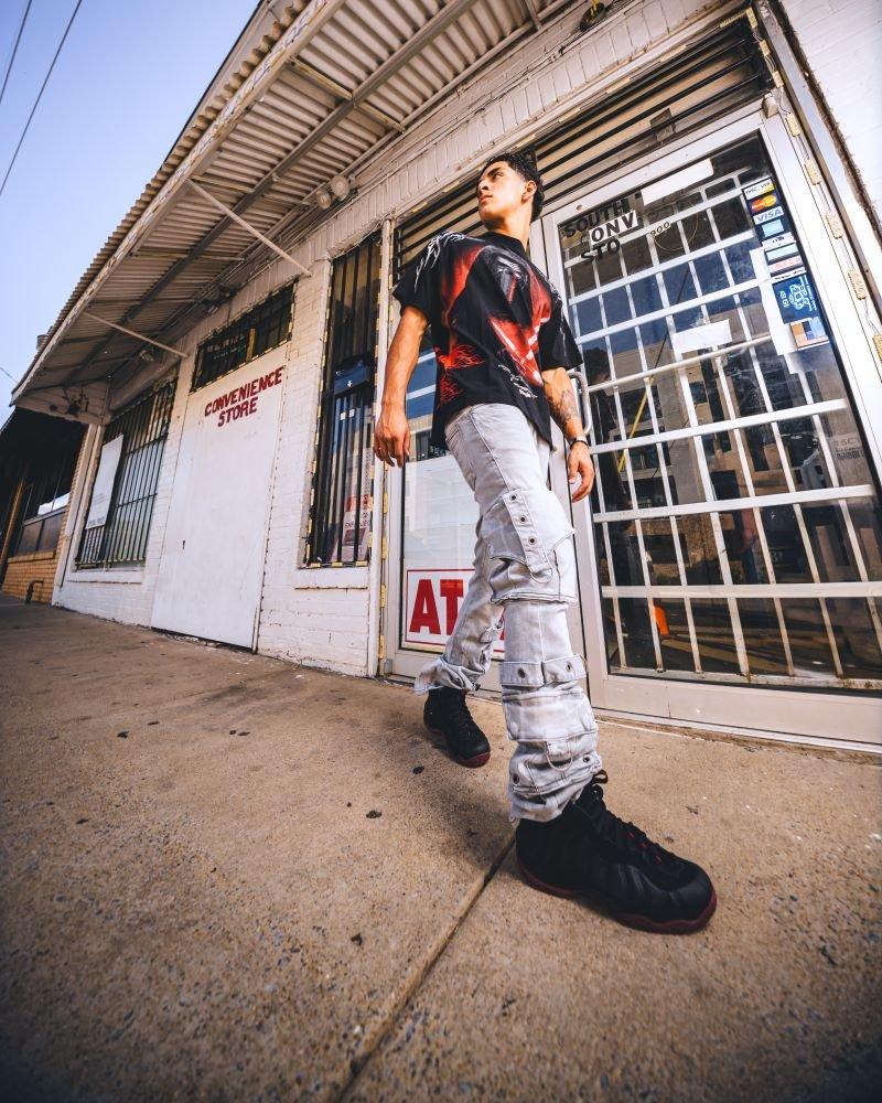 Man modeling Nike Air Foamposite One "Cough Drop"