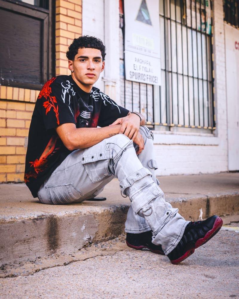 Man modeling Nike Air Foamposite One "Cough Drop"