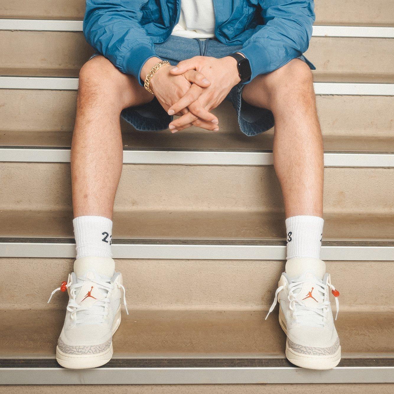 Cleared For Takeoff Ep. 3 - DJ Sneakerhead Sitting on Stairs in Jordan Spizike's