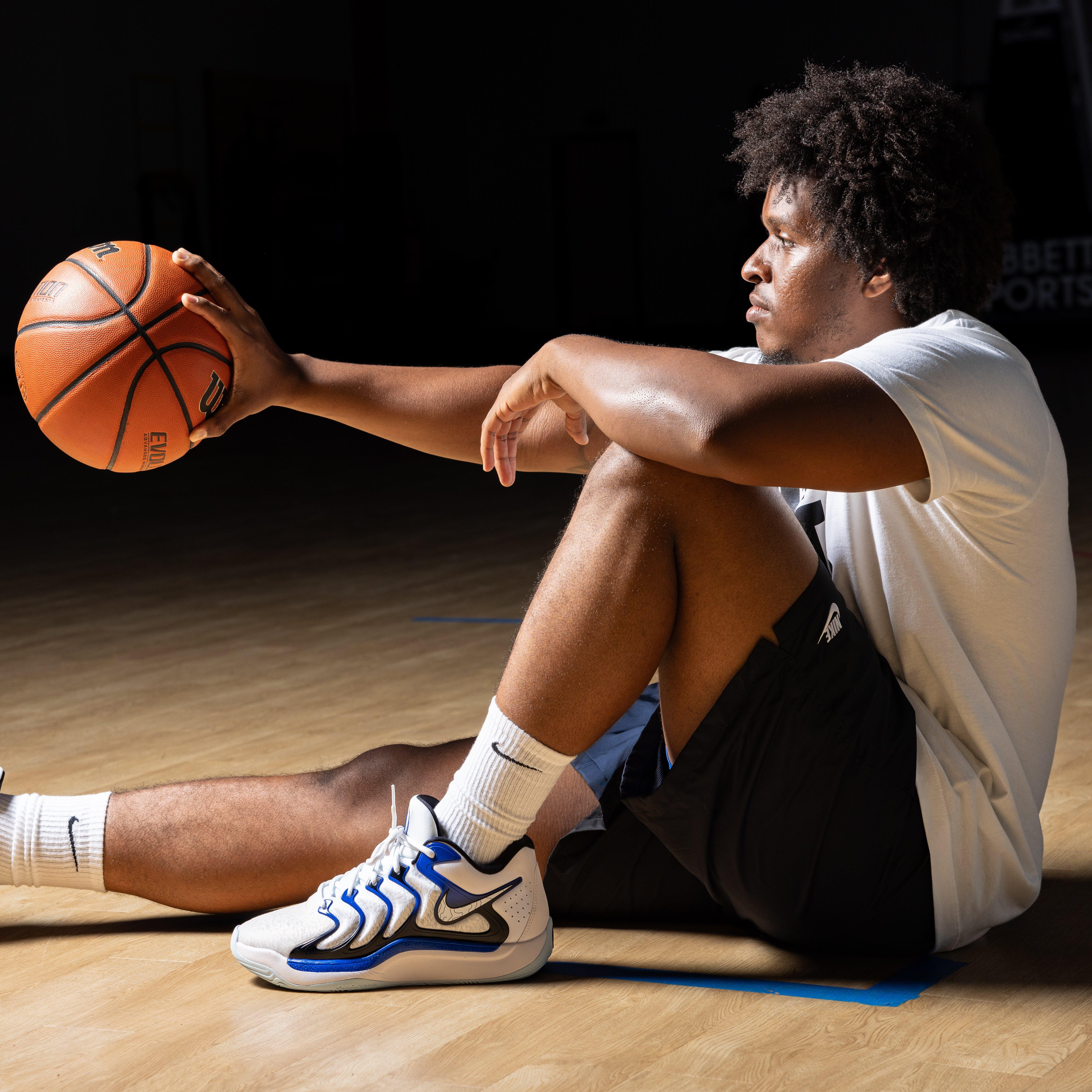 Nike KD 17 “Glacial Rift” - Model Holding Basketball with Left Shoe in Shot