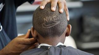 Back of Child's Head with Nike Swoosh Hair Design