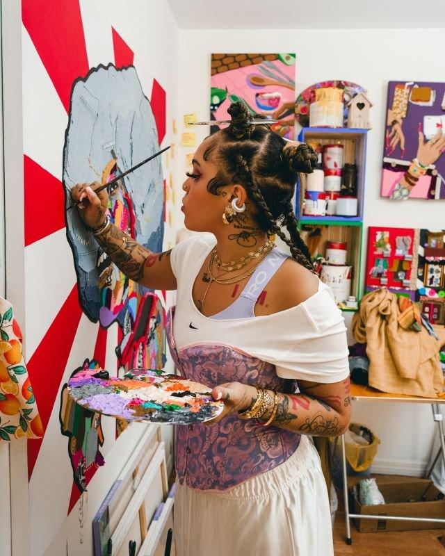 desi-swoopes-dn8-in-studio-painting-on-canvas