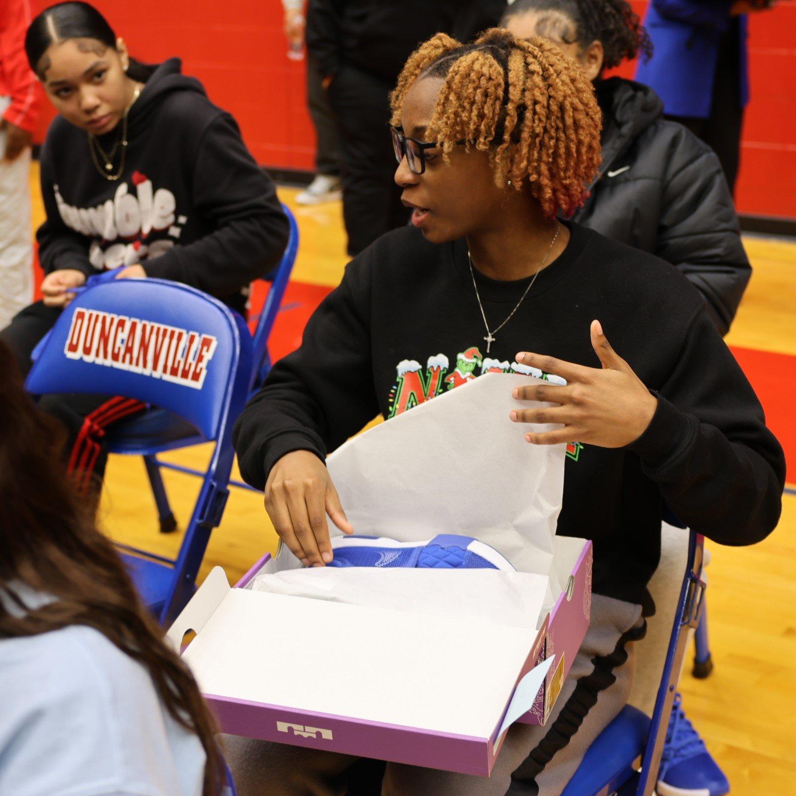 duncanville-hs-womens-basketball-player-opening-new-shoes