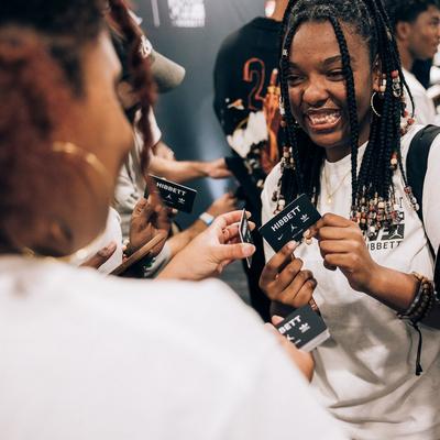 excited-teens-holding-hibbett-gift-cards