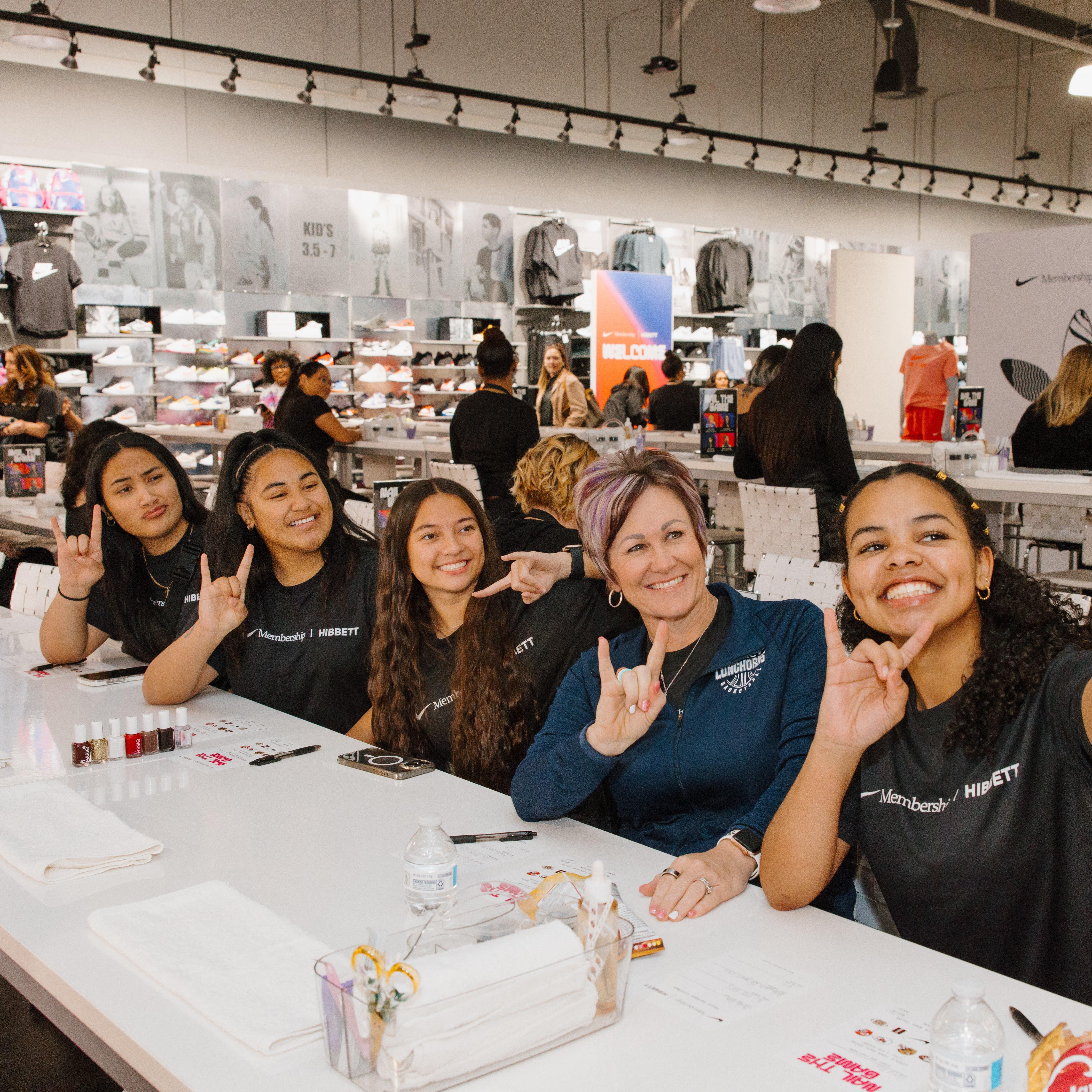 group-of-women-getting-nail-art-at-nike-connected-event