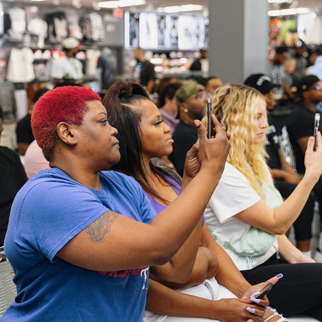 heat-check-attendees-filming-panel-discusion