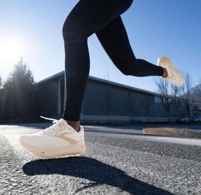 What Do I Need to Consider When Running If I Have High Arches? - Woman in HOKA and North Face Apparel