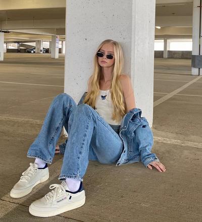 Woman modeling Reebok Club C