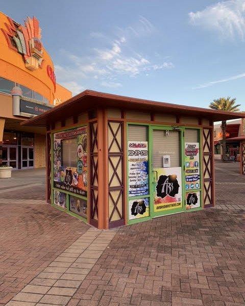 Airbrush Brothers storefront at an outdoor shopping center.