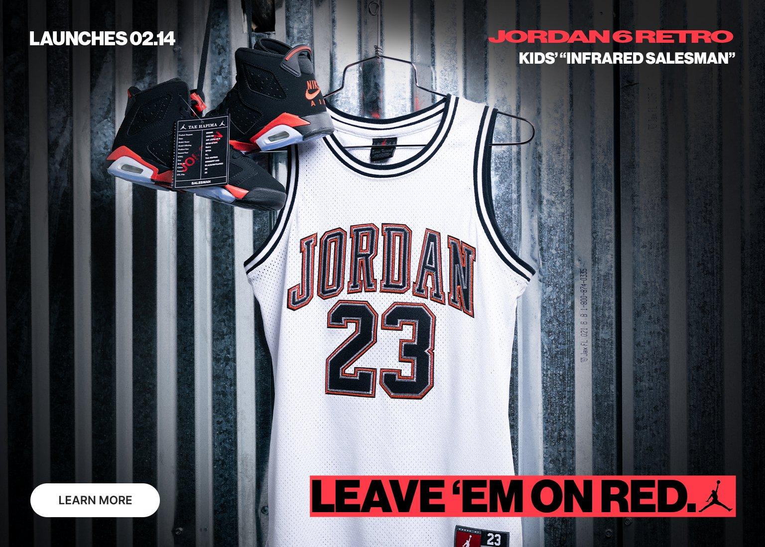 Kids’ Jordan 6 Retro “Infrared Salesman” launch banner featuring black and red sneakers and a white Jordan 23 jersey on a hanger with text “Launches 02.14” and “Leave ’Em on Red.”