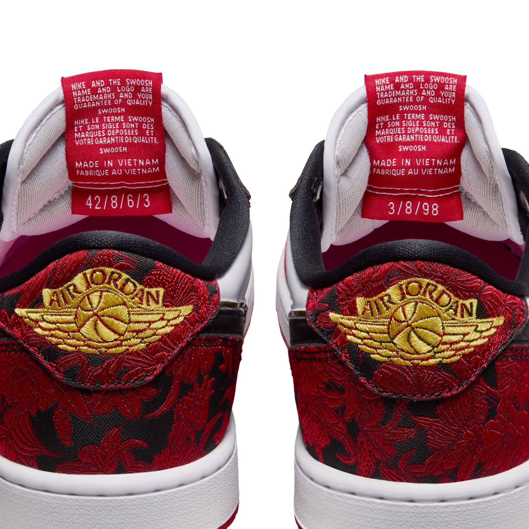 Rear view of Air Jordan 1 Retro Low OG Garden sneakers featuring gold Wings logos, red-and-black floral overlays and red interior labels.
