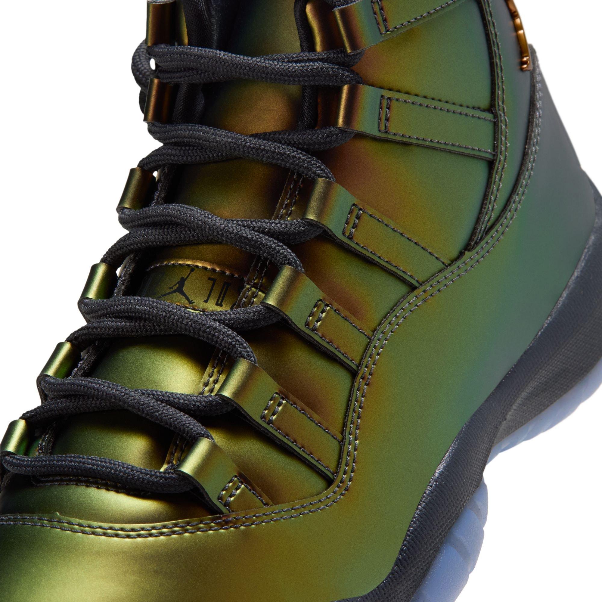 Close-up of metallic green Jordan sneakers featuring black laces, tonal lace loops and color-shifting bronze accents.