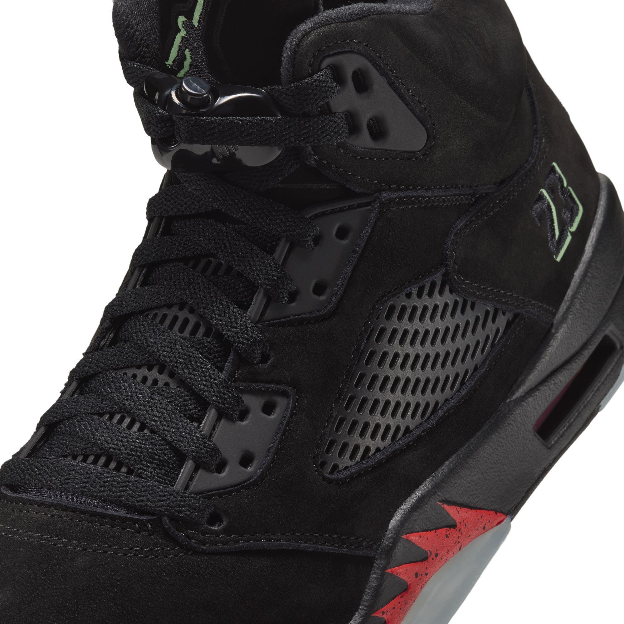 Bottom view of the Air Jordan 5 Retro Halloween sneaker showing a black midfoot panel, translucent outsole sections and a red Jumpman logo.