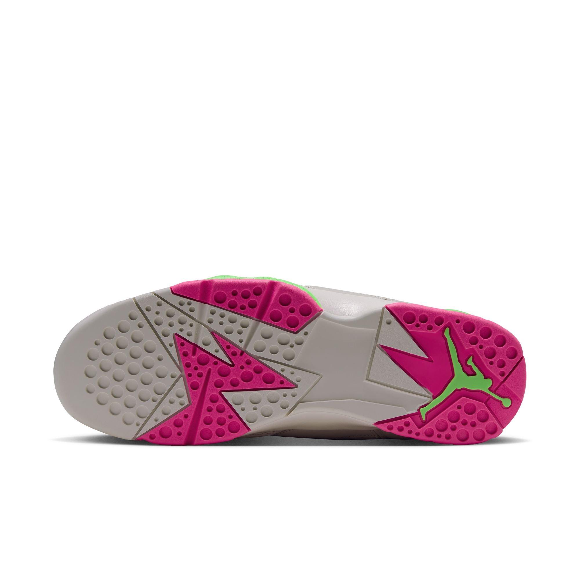 Bottom view of the Air Jordan 7 Retro &ldquo;Tennis Day&rdquo; featuring a light gray outsole with bright pink traction panels and a green Jumpman logo.