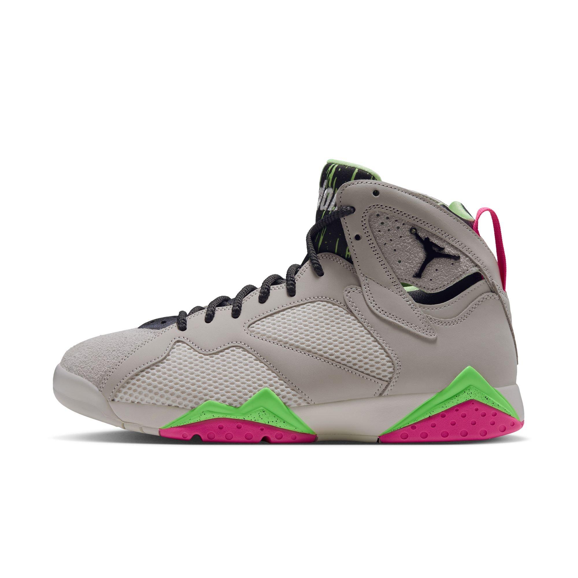 Side view of the Air Jordan 7 Retro &ldquo;Tennis Day&rdquo; featuring a light gray leather and mesh upper, black laces, green accents and bright pink outsole panels.