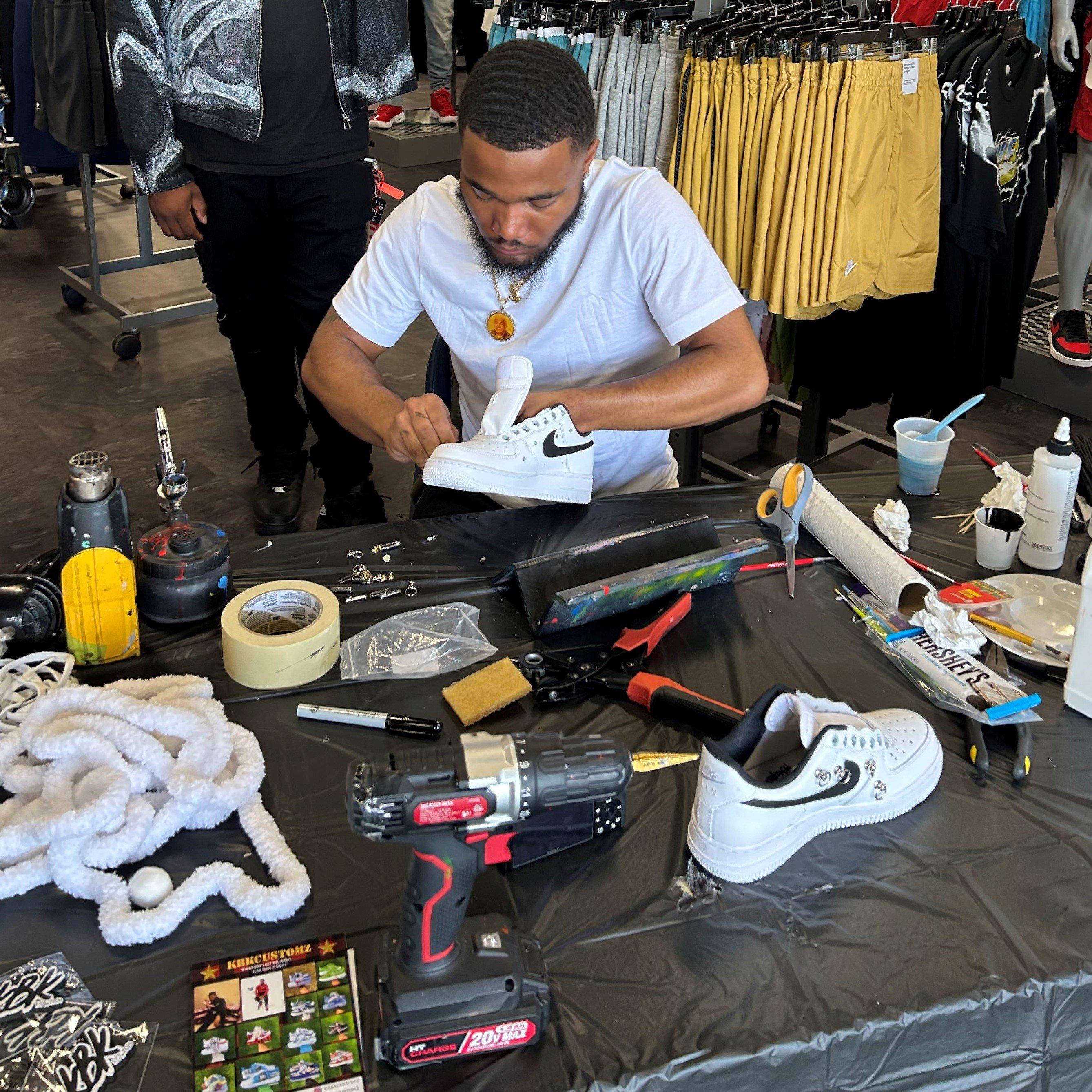 KBKCUSTOMZ working on a custom sneaker