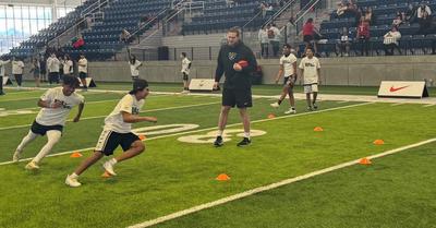 kids-running-drills-at-football-camp